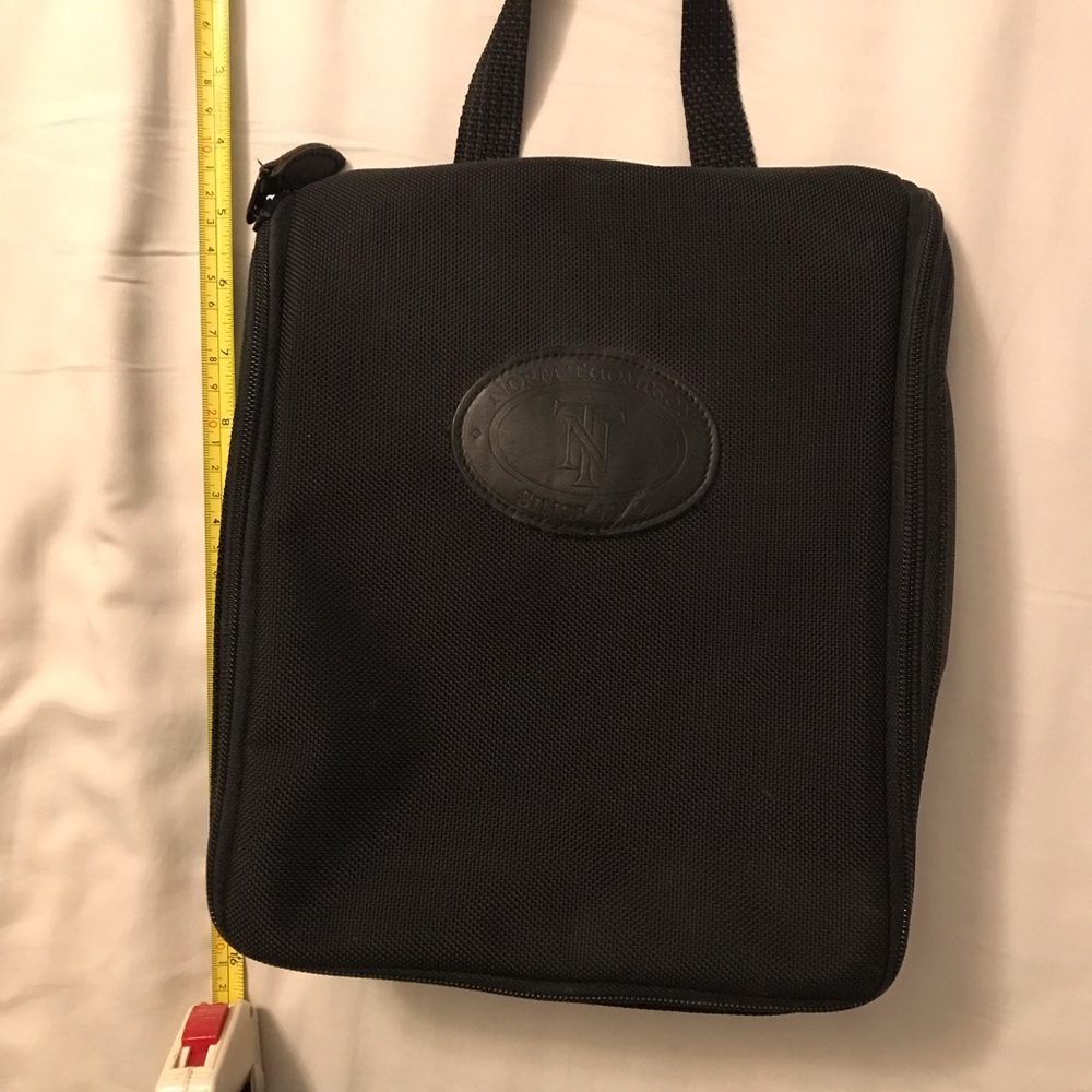 Norm Thompson black hanging toiletry kit. Very good condition.
